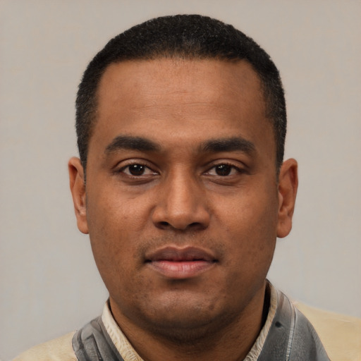 Neutral latino young-adult male with short  black hair and brown eyes