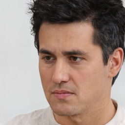 Neutral white adult male with short  black hair and brown eyes