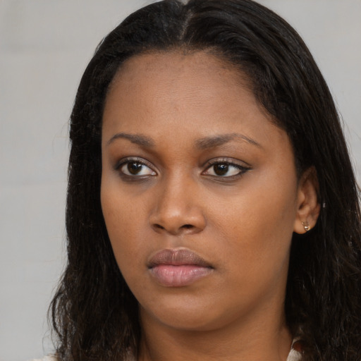 Neutral black young-adult female with long  brown hair and brown eyes