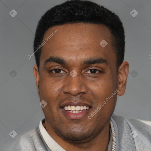 Joyful black young-adult male with short  black hair and brown eyes