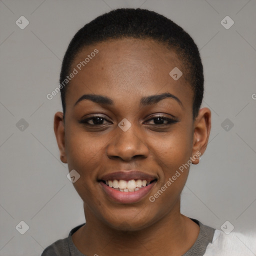 Joyful black young-adult female with short  black hair and brown eyes