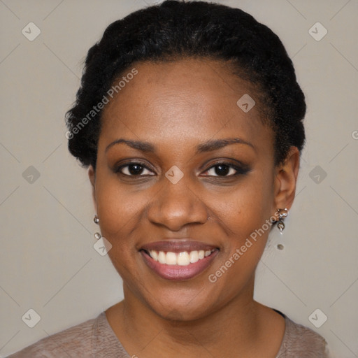 Joyful black young-adult female with short  black hair and brown eyes