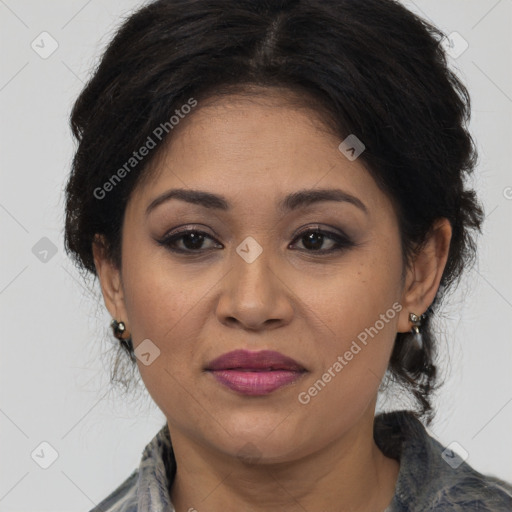 Joyful latino adult female with medium  brown hair and brown eyes