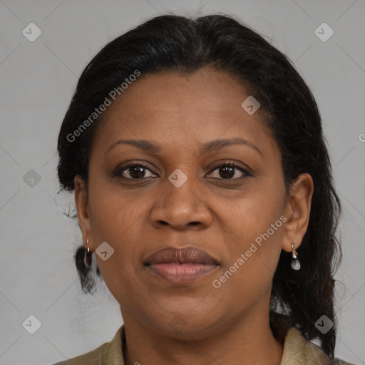 Joyful black adult female with medium  brown hair and brown eyes