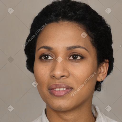 Joyful black young-adult female with short  black hair and brown eyes