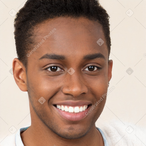 Joyful black young-adult male with short  brown hair and brown eyes