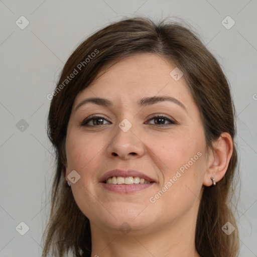 Joyful white young-adult female with long  brown hair and brown eyes