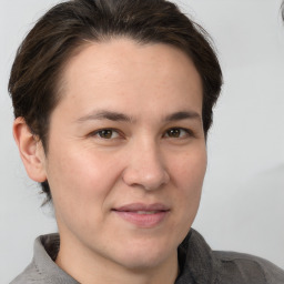 Joyful white adult female with short  brown hair and brown eyes