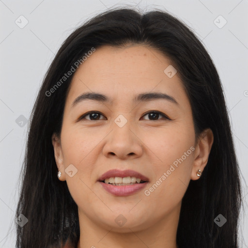 Joyful asian young-adult female with long  brown hair and brown eyes