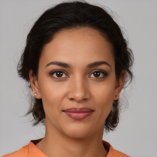 Joyful white young-adult female with medium  brown hair and brown eyes