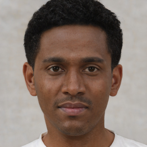 Neutral black young-adult male with short  black hair and brown eyes