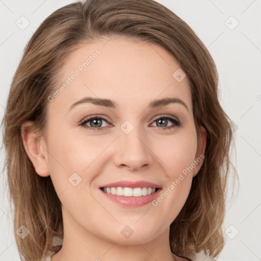 Joyful white young-adult female with medium  brown hair and green eyes