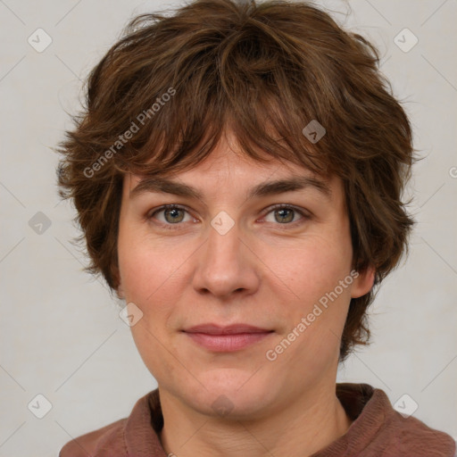 Joyful white adult female with medium  brown hair and green eyes