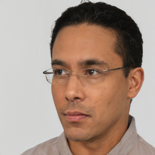 Neutral white young-adult male with short  black hair and brown eyes
