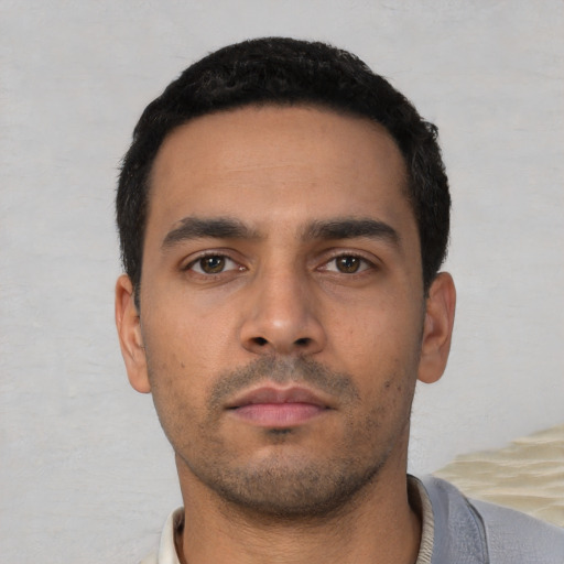 Neutral white young-adult male with short  black hair and brown eyes