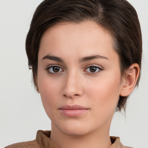 Neutral white young-adult female with medium  brown hair and brown eyes