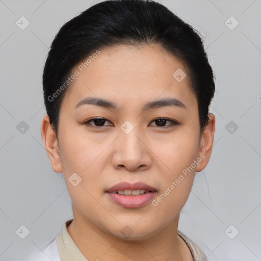 Joyful asian young-adult female with short  brown hair and brown eyes