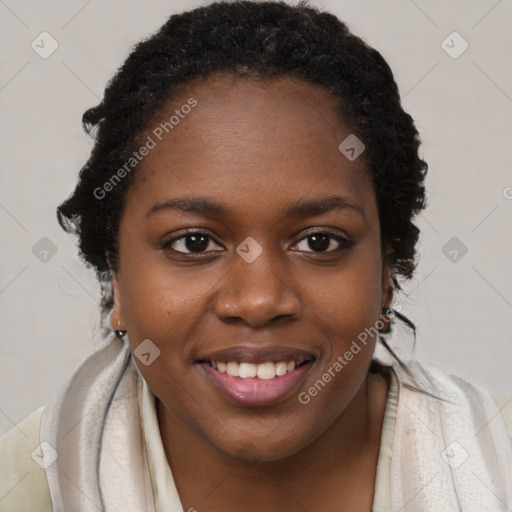 Joyful black young-adult female with long  brown hair and brown eyes