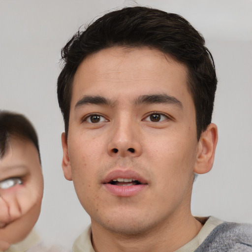 Neutral asian young-adult male with short  brown hair and brown eyes