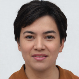 Joyful asian young-adult female with short  brown hair and brown eyes