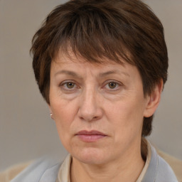 Joyful white adult female with short  brown hair and brown eyes