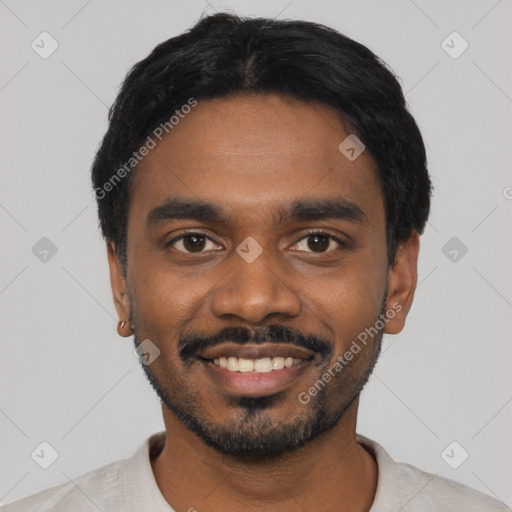 Joyful black young-adult male with short  black hair and brown eyes