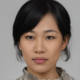 Neutral asian young-adult female with medium  black hair and brown eyes