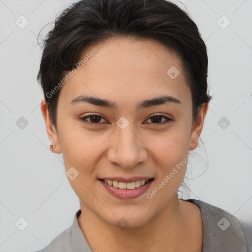 Joyful asian young-adult female with short  brown hair and brown eyes