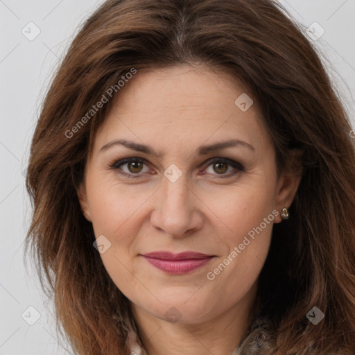 Joyful white adult female with long  brown hair and brown eyes