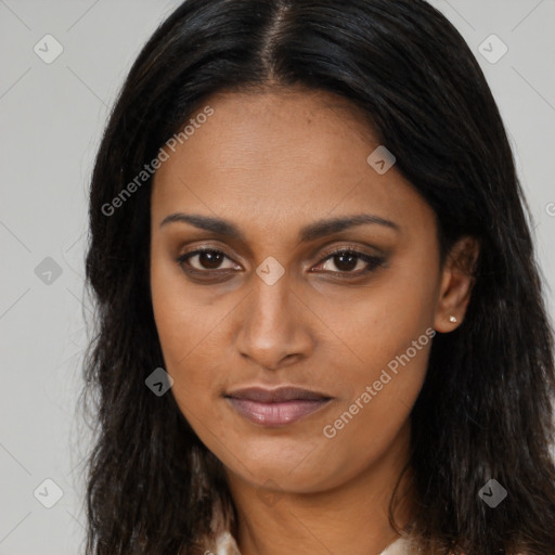 Joyful black young-adult female with long  brown hair and brown eyes