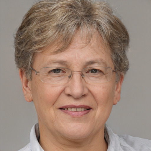 Joyful white middle-aged female with short  brown hair and brown eyes