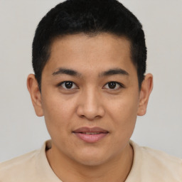 Joyful asian young-adult male with short  black hair and brown eyes