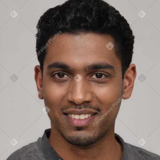 Joyful black young-adult male with short  black hair and brown eyes