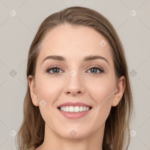 Joyful white young-adult female with long  brown hair and grey eyes