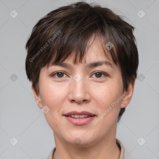 Joyful white adult female with short  brown hair and brown eyes