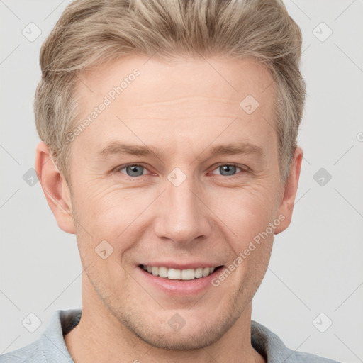 Joyful white adult male with short  brown hair and grey eyes