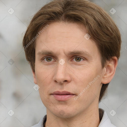 Joyful white adult male with short  brown hair and grey eyes