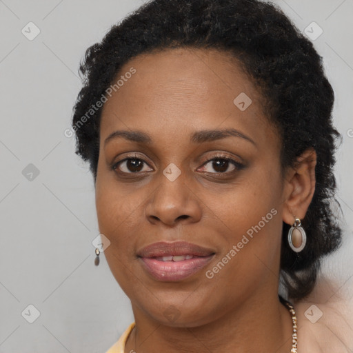 Joyful black young-adult female with long  brown hair and brown eyes