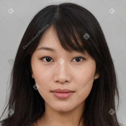 Joyful asian young-adult female with long  brown hair and brown eyes