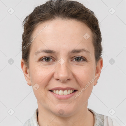 Joyful white adult female with short  brown hair and brown eyes