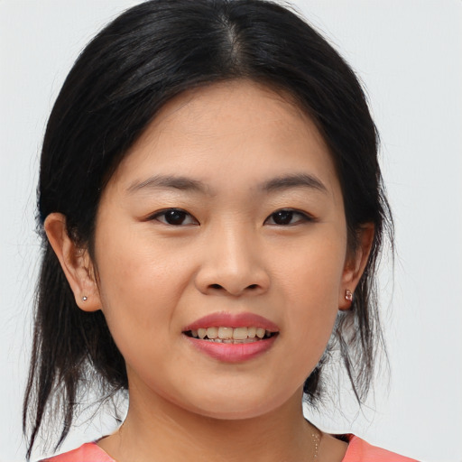 Joyful asian young-adult female with medium  brown hair and brown eyes