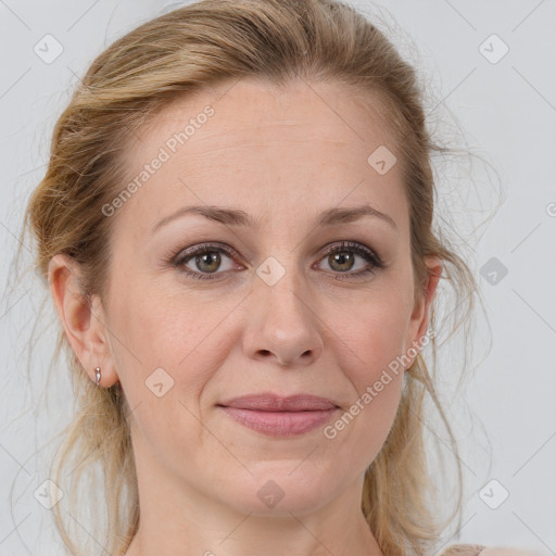 Joyful white adult female with medium  brown hair and blue eyes