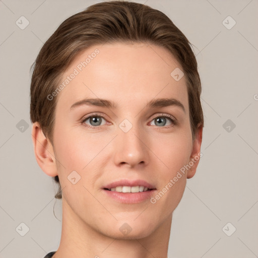 Joyful white young-adult female with short  brown hair and grey eyes