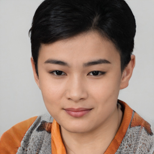 Joyful asian young-adult female with short  black hair and brown eyes