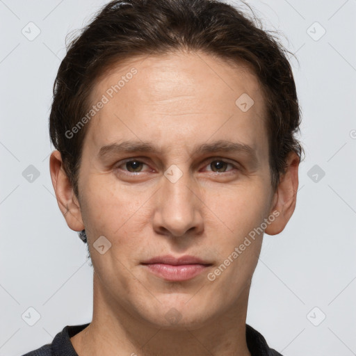 Joyful white adult male with short  brown hair and grey eyes