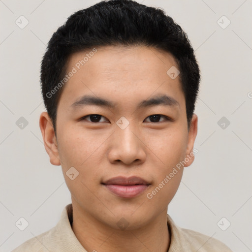 Joyful asian young-adult male with short  black hair and brown eyes