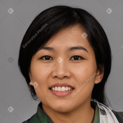 Joyful asian young-adult female with medium  black hair and brown eyes