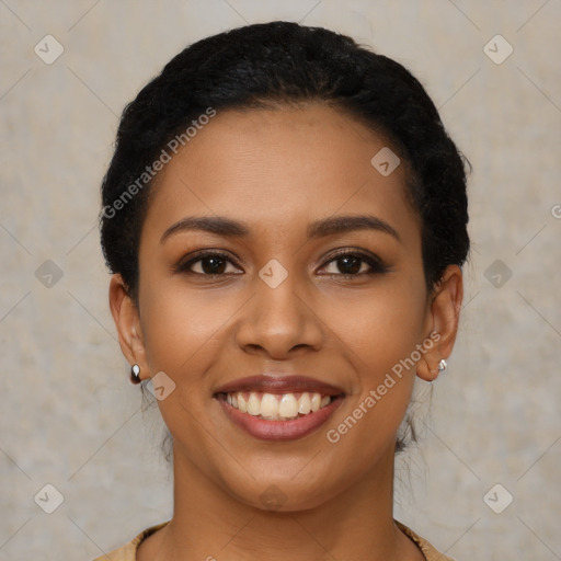 Joyful latino young-adult female with short  brown hair and brown eyes