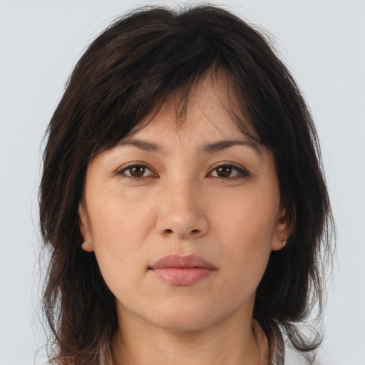 Neutral asian young-adult female with medium  brown hair and brown eyes