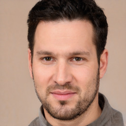 Joyful white young-adult male with short  brown hair and brown eyes